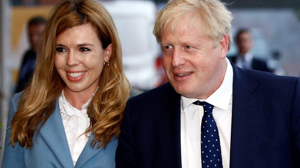 Boris Johnson and his girlfriend Carrie Symonds arrive at a hotel ahead of the Conservative Party annual conference in Manchester, on 28 September 2019