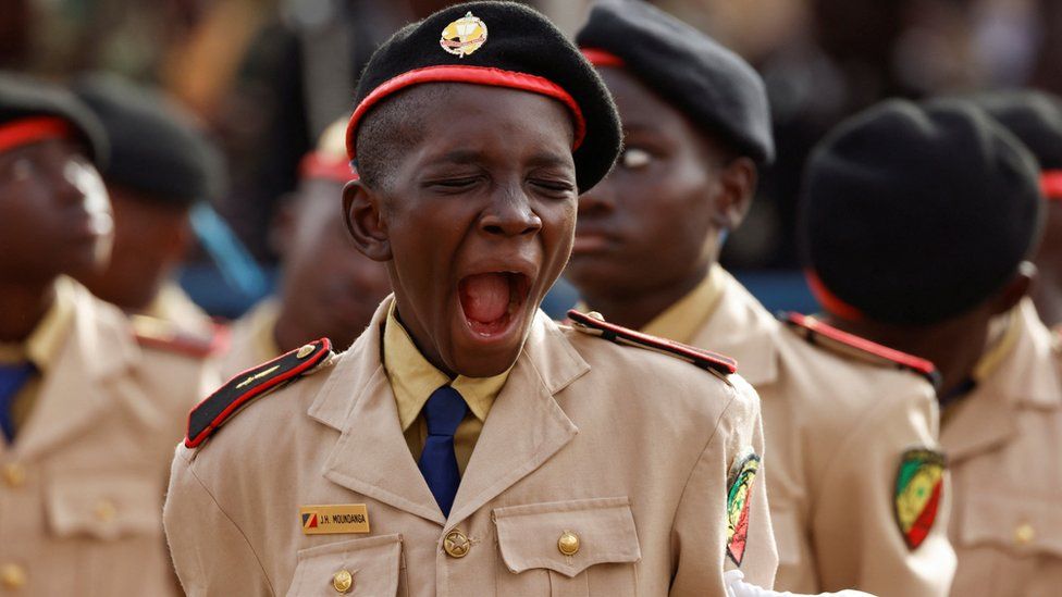 A student yawns during military parade marking Senegal's Independence Day in Dakar, Senegal on 4 April 2023.