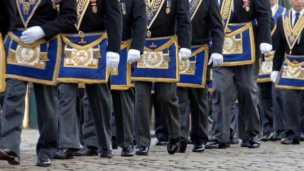 Freemasons march in a procession