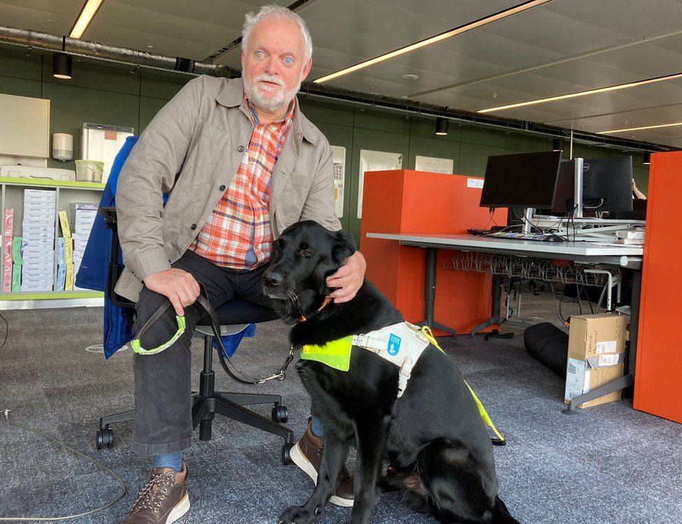 Ian, who has worked for the BBC for 23 years, with his latest guide dog Major