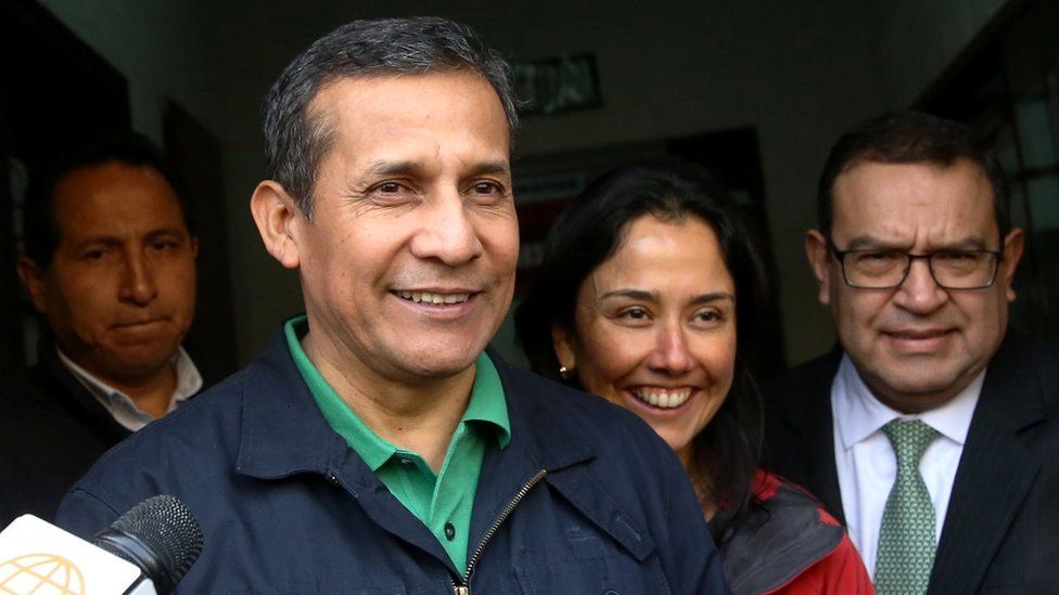Peru's former President Ollanta Humala and his wife, Nadine Heredia, leaving the Nationalist Party headquarters in Lima on Thursday, while smiling broadly