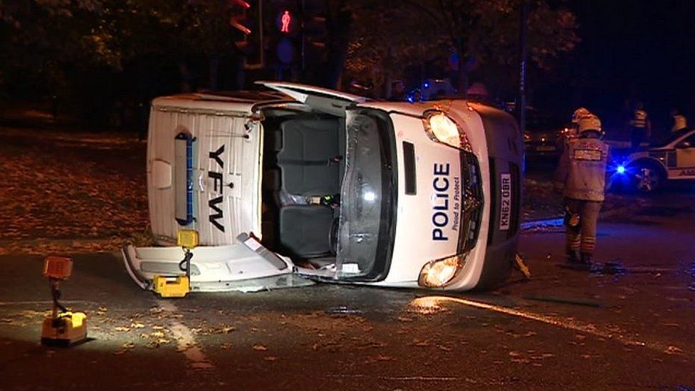 Four hurt as police van collides with taxi - BBC News