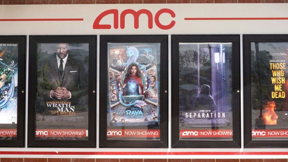 Movie posters outside of an AMC cinema