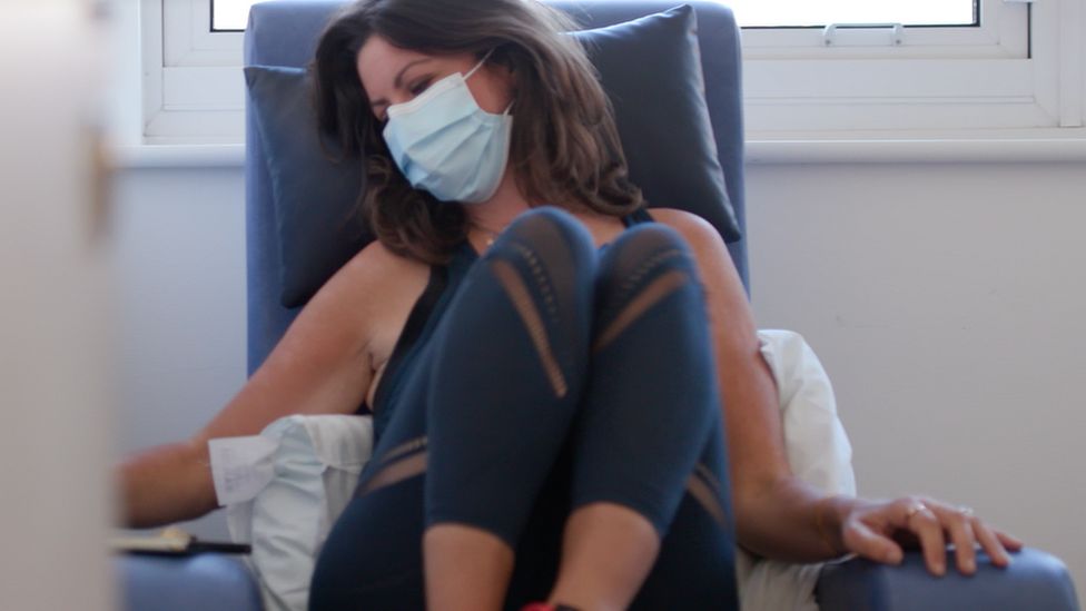 woman wearing mask having chemotherapy