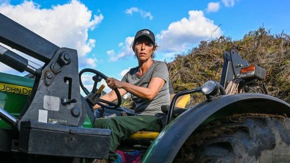 Aida drives a tractor in her village of Covas do Barroso