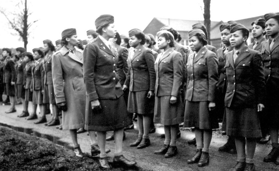 Maj. Charity E. Adams,...and Capt. Abbie N. Campbell inspect the first contingent of members of the Women's Army Corps