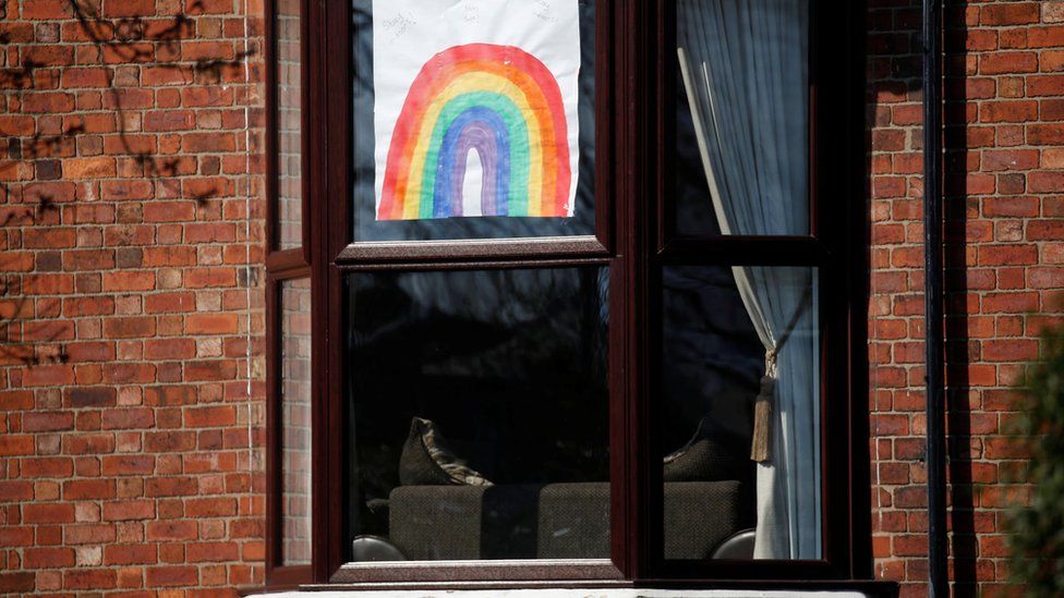 A hand-drawn picture of a rainbow is seen in a window in Liverpool, as the spread of coronavirus disease (COVID-19) continues. Liverpool, Britain