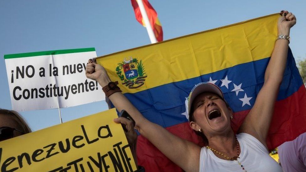 A woman shouts slogans during a protest held by Venezuelans in Spain against Venezuela's Constituent Assembly election, in Madrid, Spain, July 30, 2017.