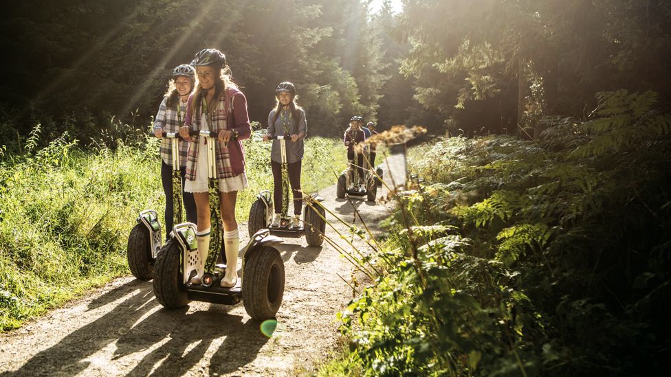 People riding Go Ape Segways