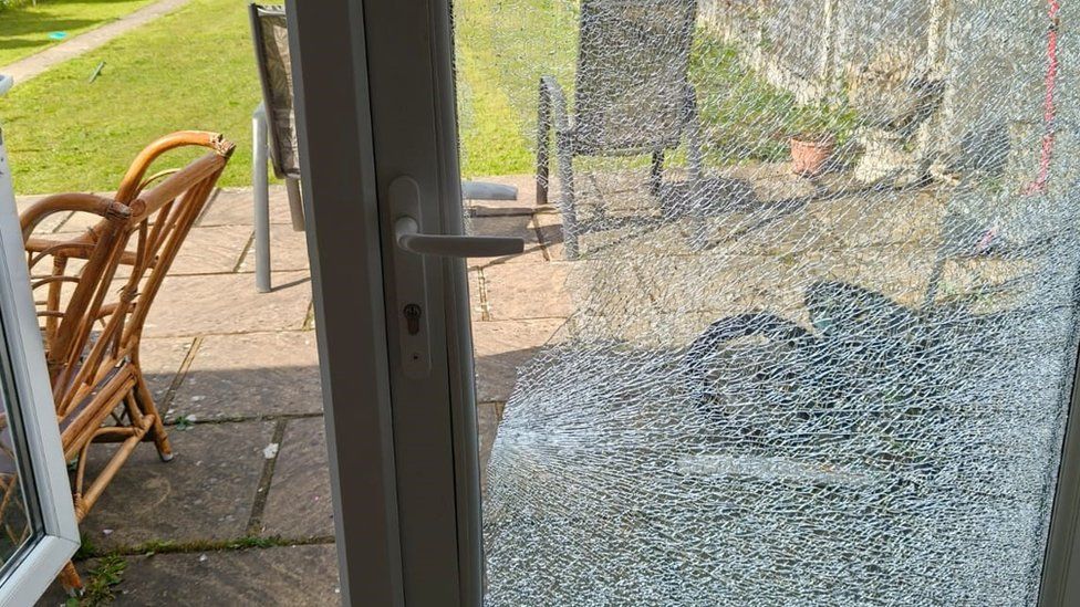 Smashed door at Mr Singh's Reading home