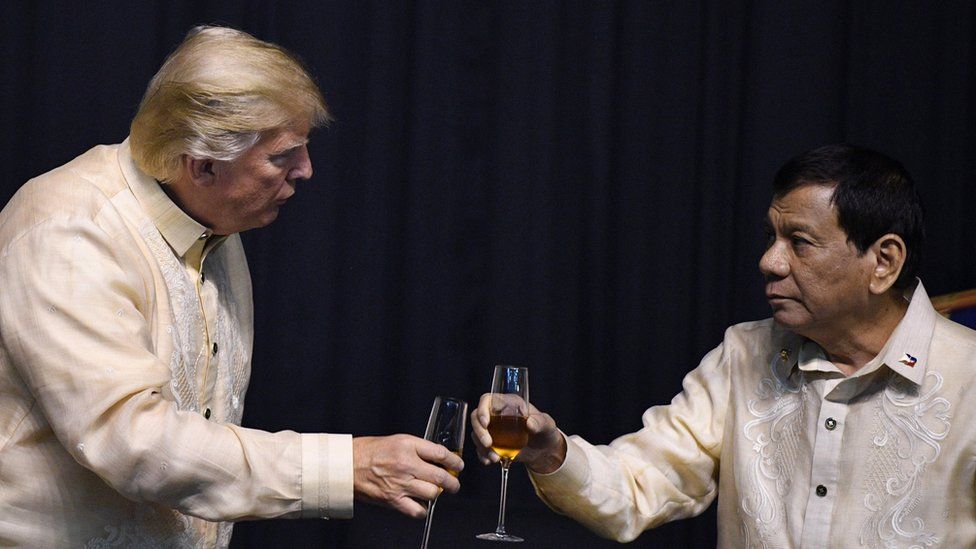 Philippine President Rodrigo Duterte (R) toasts US President Donald Trump during a special gala celebration dinner for the Association of Southeast Asian Nations (ASEAN) in Manila on November 12, 2017.