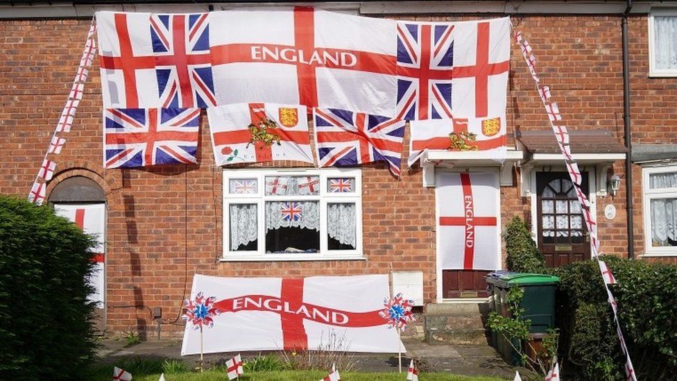 House covered in St George's flags