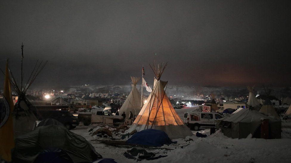 Night falls on Oceti Sakowin Camp on the edge of the Standing Rock Sioux Reservation on December 1, 2016