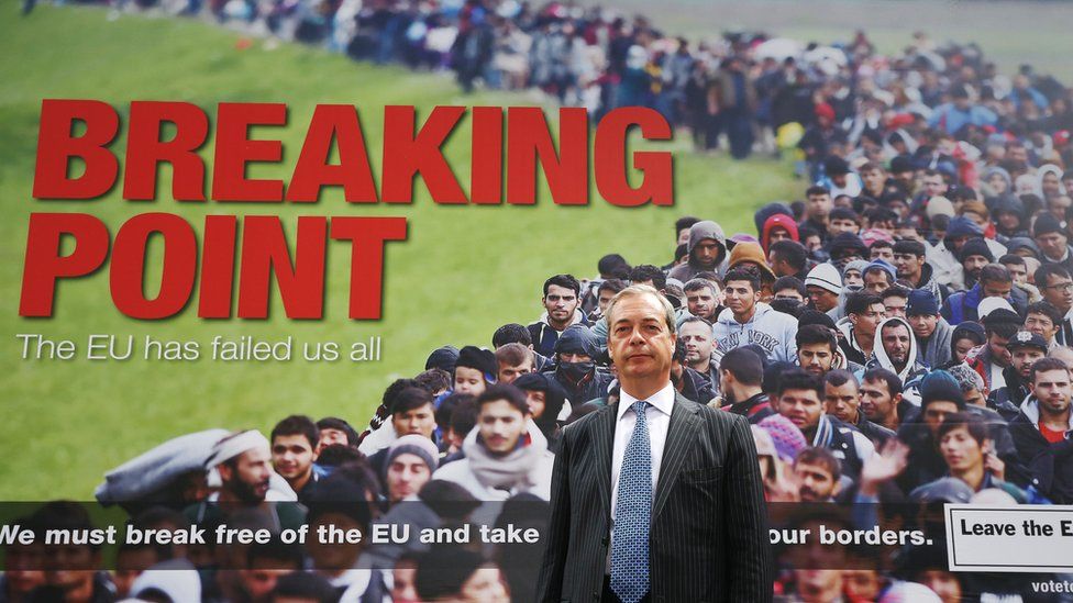 Nigel Farage with UKIP poster