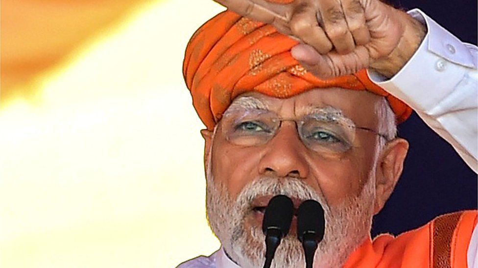 India's prime minister Narendra Modi addresses a gathering during a Bhartiya Janata Party (BJP) rally ahead of Gujarat state elections at Dehgam, some 40 kms from Ahmedabad on November 24, 2022.