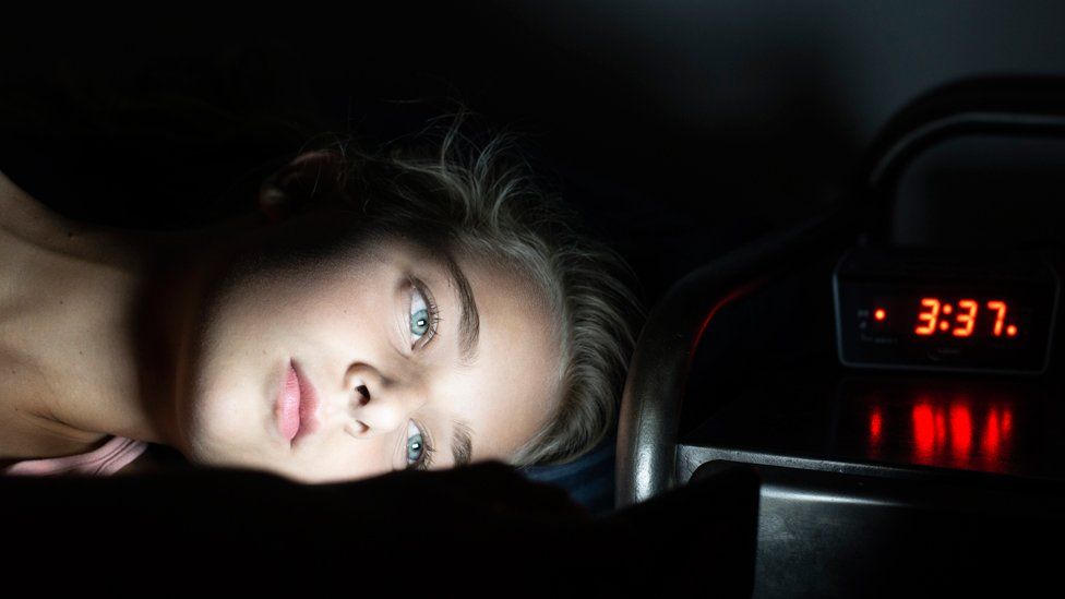 Child on screen in bed