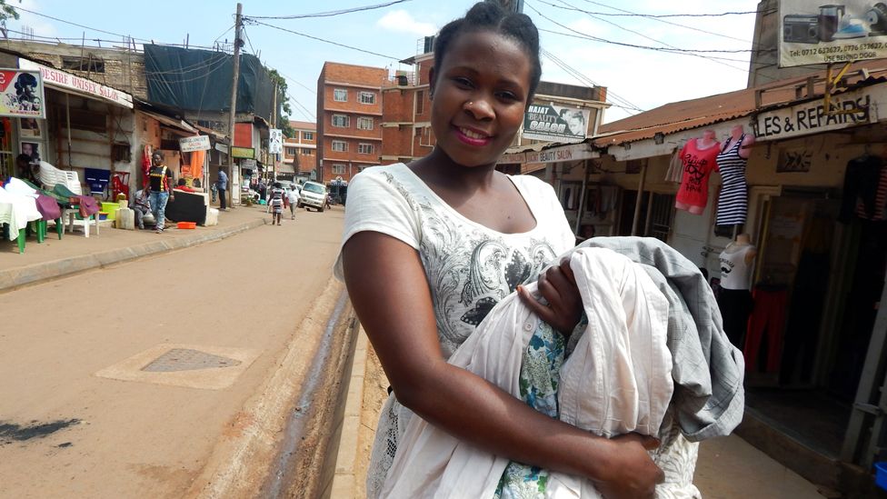 Sandra Birabwa selling clothing in central Kampala. Photo: Patience Atuhaire, BBC Africa