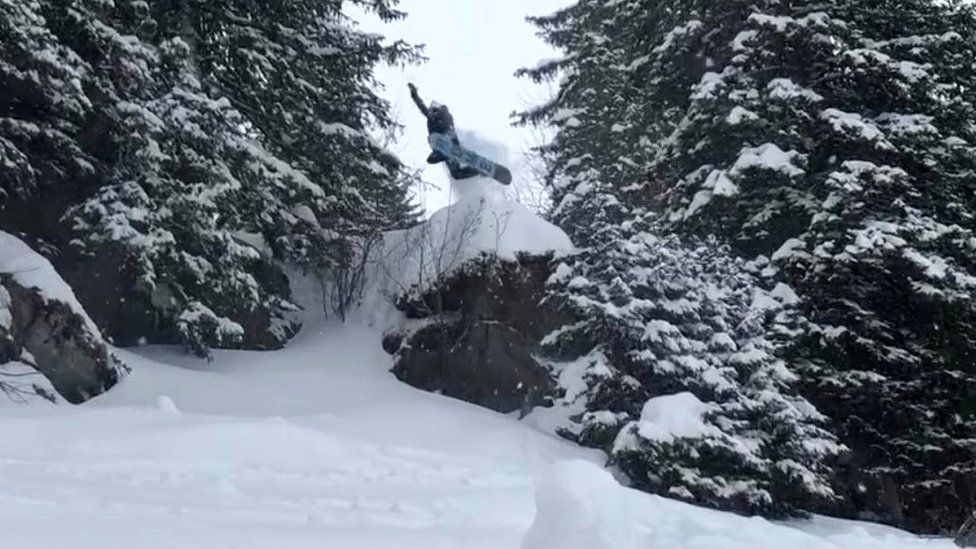 Davy snowboarding in Canada