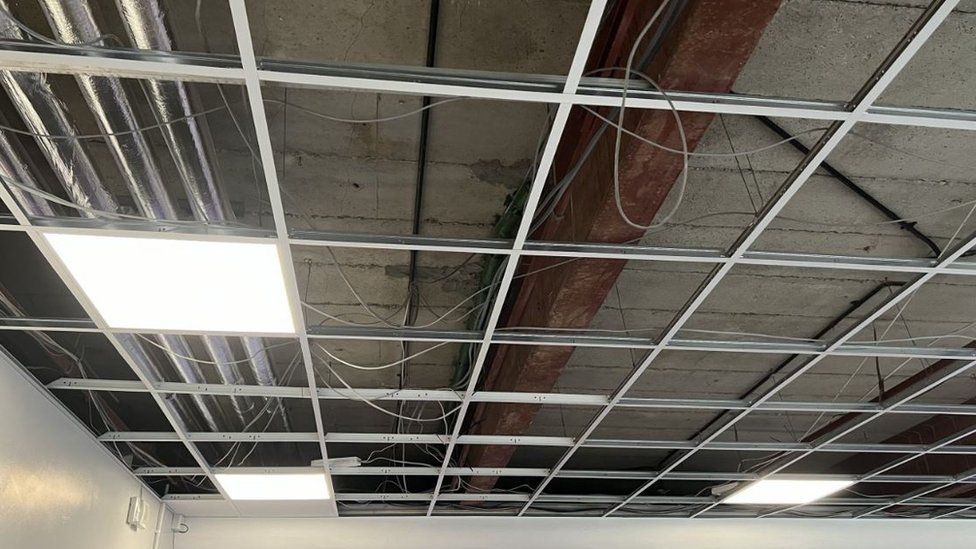 The cracked concrete ceiling at the Blue School
