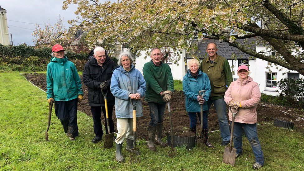 Volunteers planting vegetable patch in Landrake graveyard - BBC News