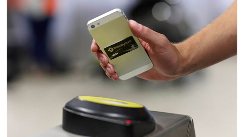 An iPhone used to make a contactless payment on the London Underground