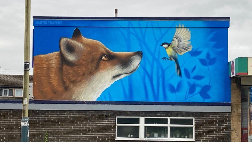 A mural of a fox and a bird