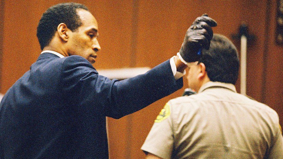 OJ Simpson shows jury a leather glove allegedly used in the murders
