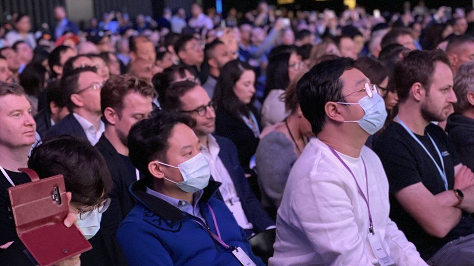 Attendees at the Samsung event in San Francisco wear surgical face masks