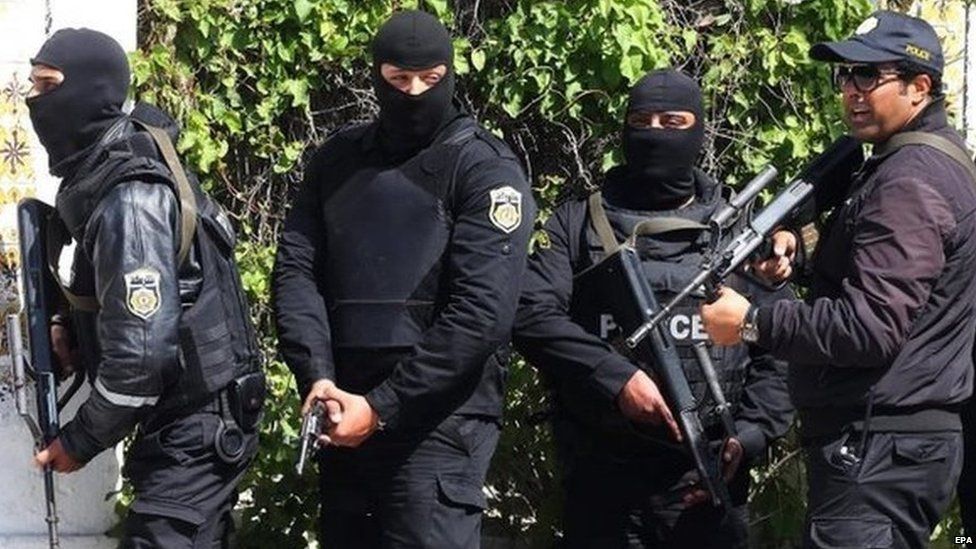 Members of the Tunisian security services take up positions after gunmen reportedly took hostages near the country's parliament, outside the National Bardo Museum, Tunis, Tunisia, 18 March 2015