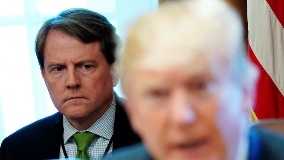 White House Counsel Don McGahn sits behind US President Donald Trump as the president holds a cabinet meeting at the White House in Washington on 21 June 2018.