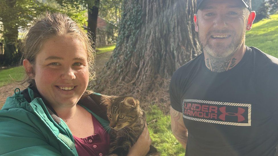 Photo of Willow the kitten with her owner Meghan Blainaut and her rescuer Mike Bailey