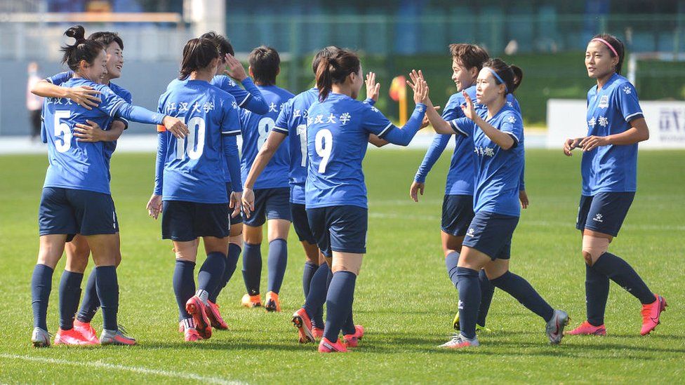 Players of Wuhan Jianghan University react during their Chinese Football Association (CFA) women's super league match against Henan Jianye women FC in Kunming in China's south-western Yunnan province on 23 August 2020