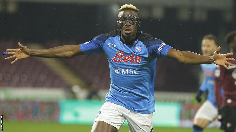 Victor Osimhen spreads his arms wide in celebration of a Napoli goal