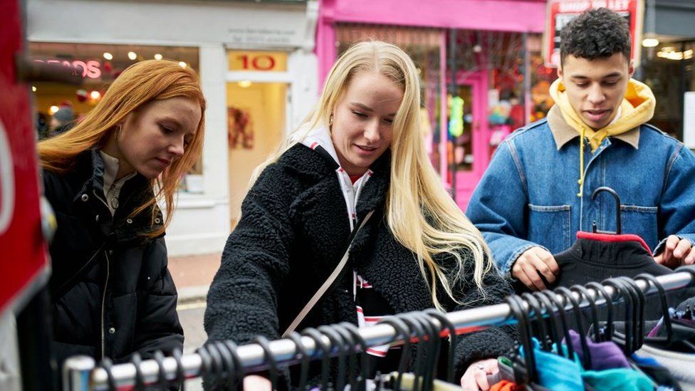 Young people shopping for clothes