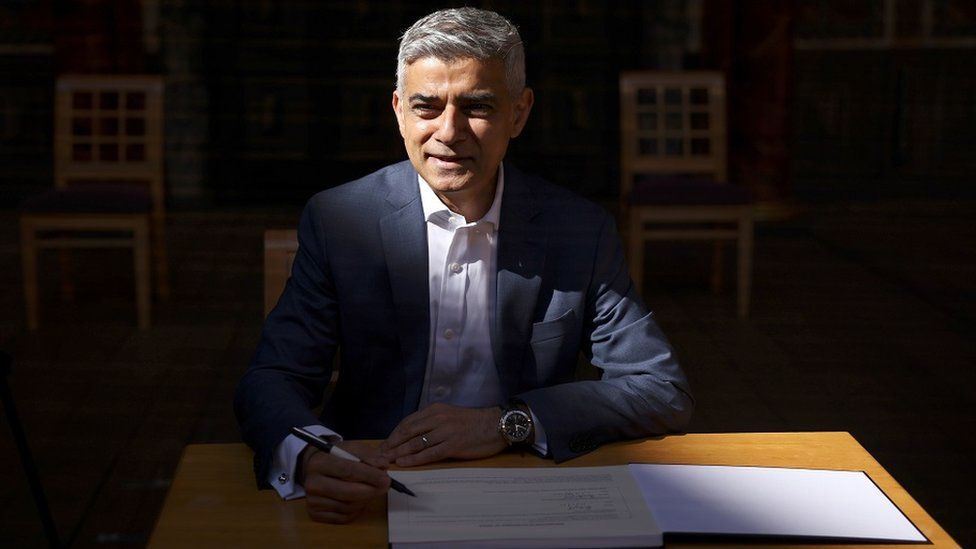 Mayor of London Sadiq Khan signs in for a second term after being re-elected as mayor, during a ceremony at the Shakespeare"s Globe i