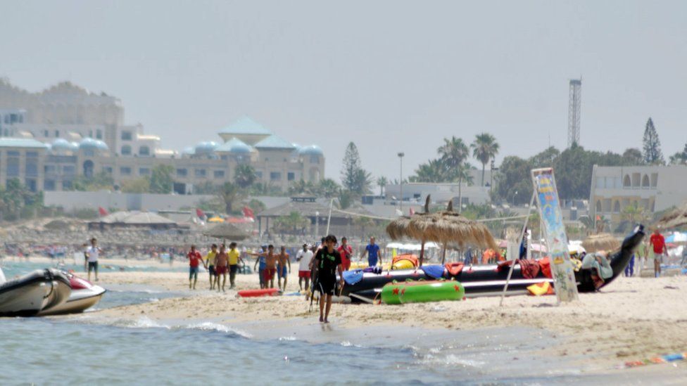 Tunisians following Rezgui on the beach