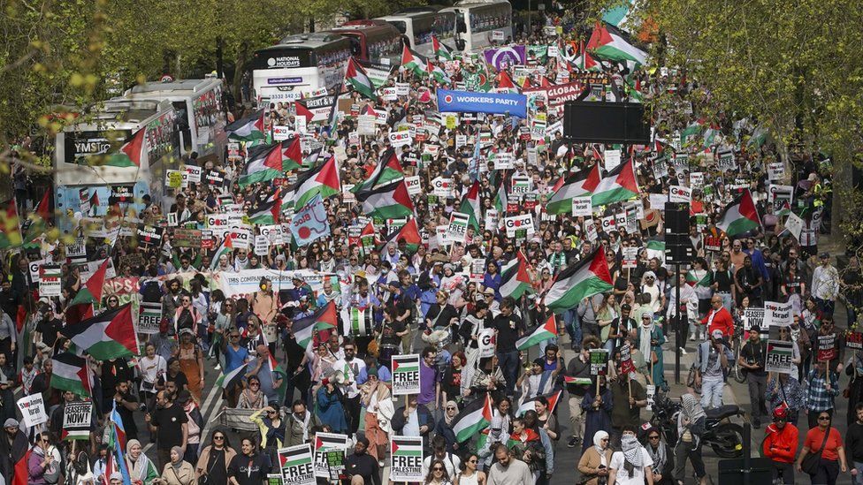 People take part in a pro-Palestine march in central London on 13 April