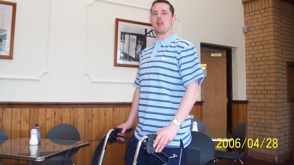 Colin with his "zoomer" walking frame years after his stroke