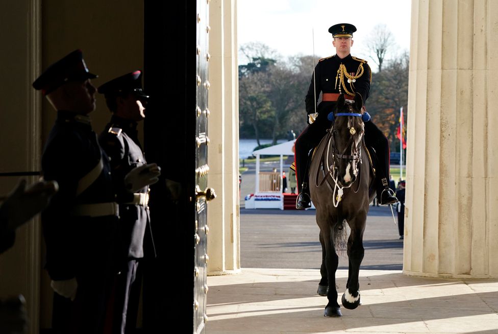 Sandhurst Academy Adjutant Major Chris Davies rides horse Falkland into the Old College building following the Sovereign's Parade at the Royal Military Academy Sandhurst (RMAS) in Camberley, Berkshire,10 December 2021.