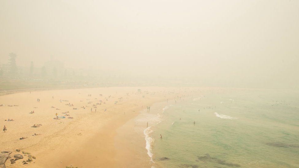 Bondi Beach obscured by a thick layer of smoke