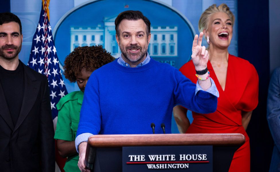 Actor Jason Sudeikis (C) from the show Ted Lasso, alongside other cast members Hannah Waddingham (R) and Brett Goldstein (L), and White House Press Secretary Karine Jean-Pierre (2-L), speaks about 'the importance of addressing mental health to promote overall well-being' in the press briefing at the White House in Washington, DC, USA, 20 March 2023.
