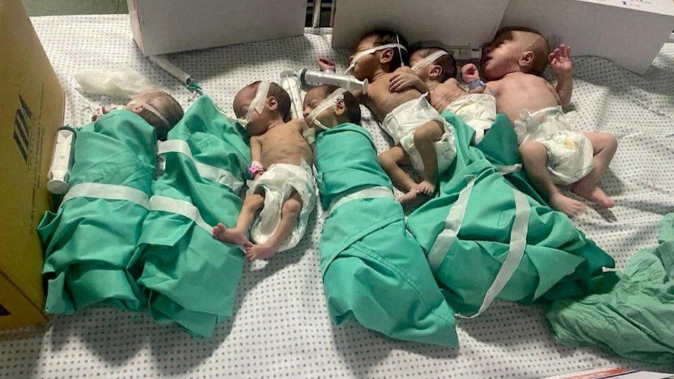 Newborns are placed in bed after being taken off incubators in Gaza's Al-Shifa hospital after power outage