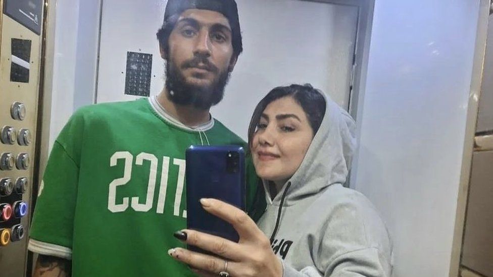 A photograph showing Erfan Rezaei and his mother two days before his death