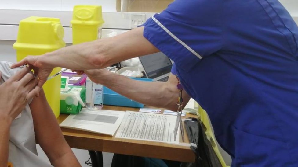 BAME staff member being vaccinated