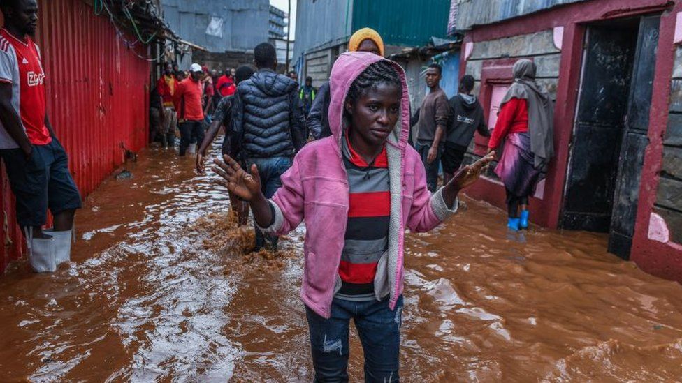 Residents are seen successful  a flooded thoroughfare  of Mathare vicinity  aft  dense  rains arsenic  they effort   to evacuate the country  with their important   belongings successful  Nairobi, Kenya connected  April 24, 2024