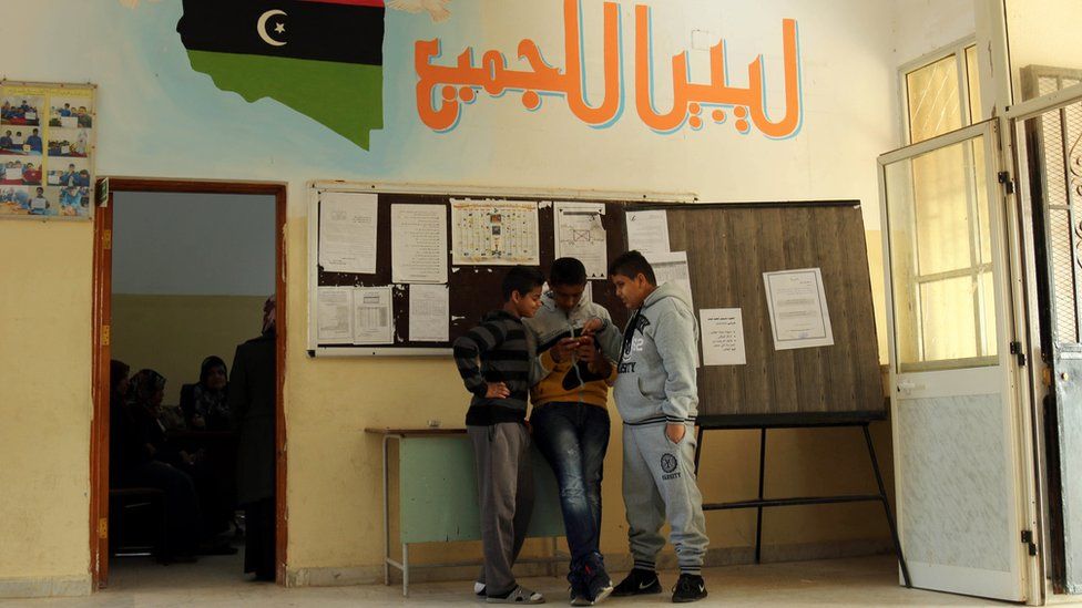 Libyan students stand at the al-Bashayer school in the eastern coastal city of Benghazi on December 13, 2015, as they come back to school for the first time since August 2014 when Islamist-backed militias seized Tripoli, prompting the internationally recognised government to take refuge in the far east of the country.