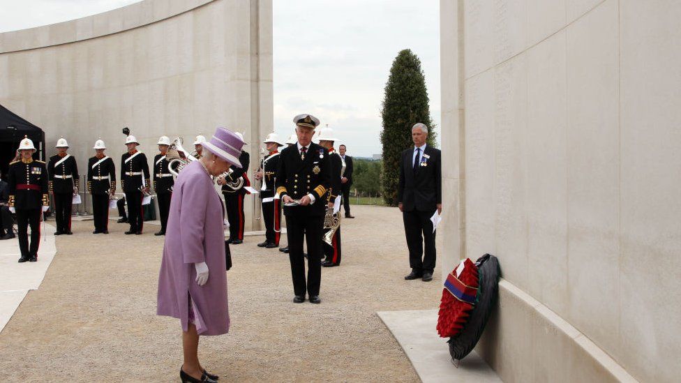 Queen Elizabeth II lays a wreath during a visit to the National Memorial Arboretum to attend a service of thanksgiving to mark the return of soldiers from the Royal Mercian and Lancastrian Yeomanry after a five-month tour of duty in Afghanistan's Helmand province on July 20, 2011 in Staffordshire
