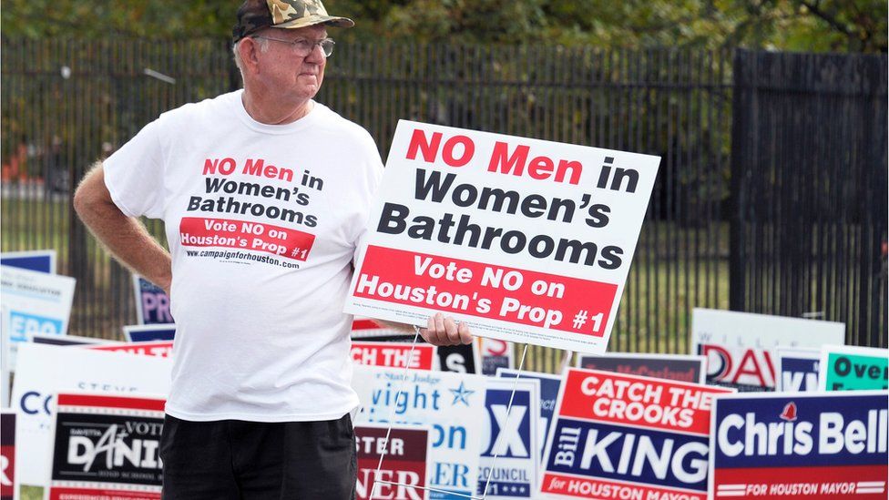 A man urges people to vote against the Houston Equal Rights Ordinance outside an early voting centre in Houston