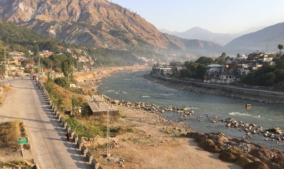 A view of Muzaffarabad. Neelum River divides the main city from hillside settlements