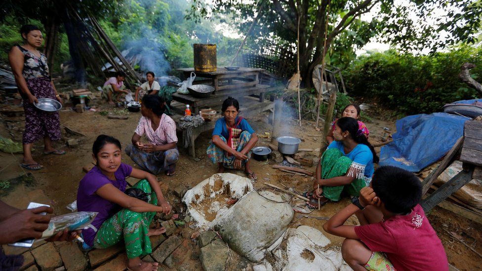 Ethnic Rakhine people who fled from Maungdaw after Arakan Rohingya Salvation Army (ARSA) had attacked, cook their meal at Buthidaung, Myanmar on 28 August 2017